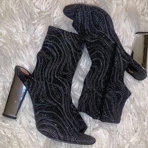 Open Back/peep toe pumps embellished heels.